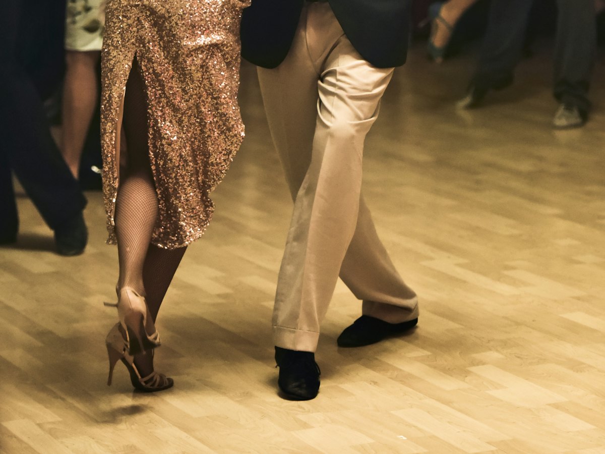 Couples dancing together on a crowded floor.