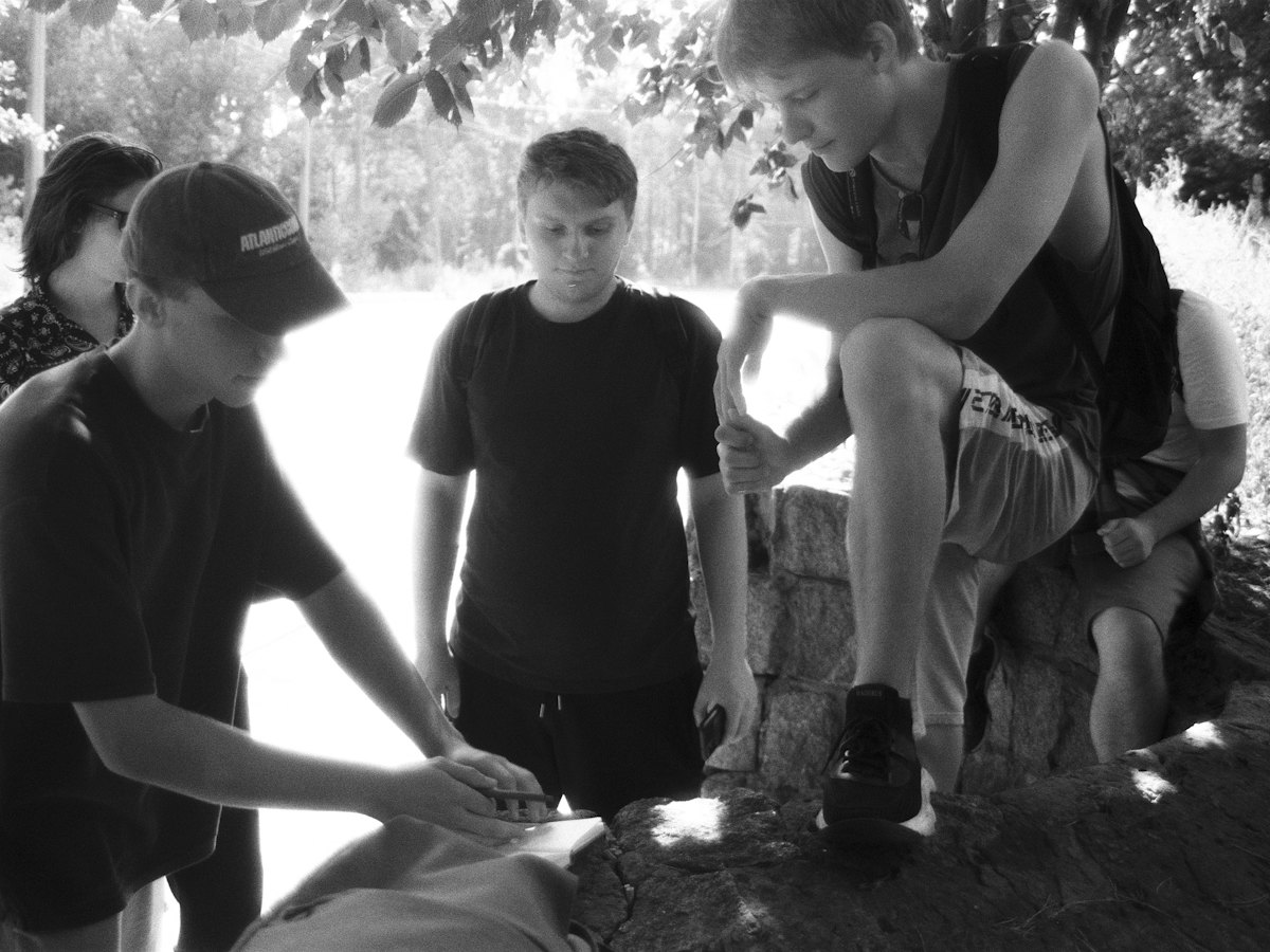 A group practising first aid on a volunteer.